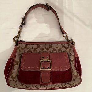 Collectible leather coach shoulder bag.